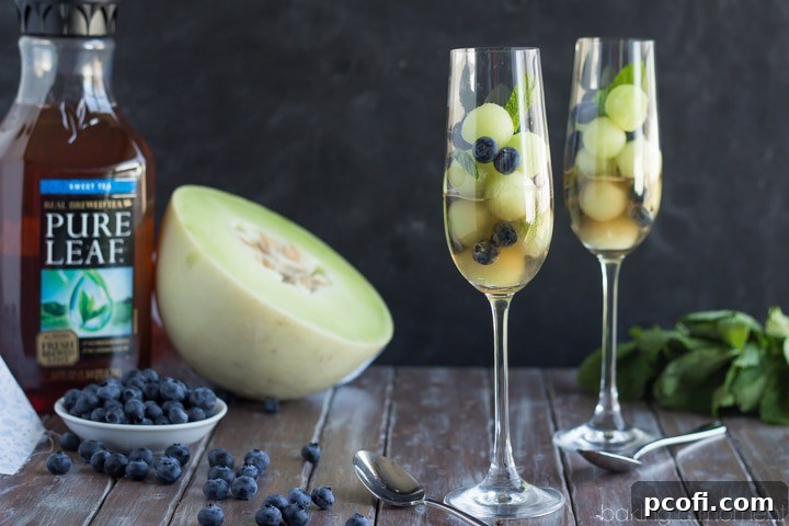 Simple as can be and so refreshing! These melon balls in tea with blueberries and mint will definitely be making an appearance at our next brunch! #puresummer #ad