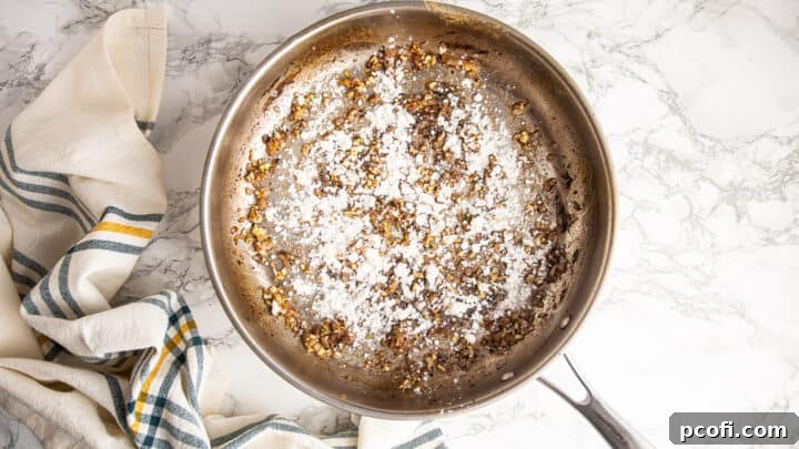 Shallots and garlic coated with flour to form a roux, thickening the sauce.