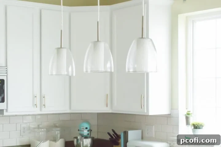 Stylish kitchen detail with golden cabinet pulls and modern design elements