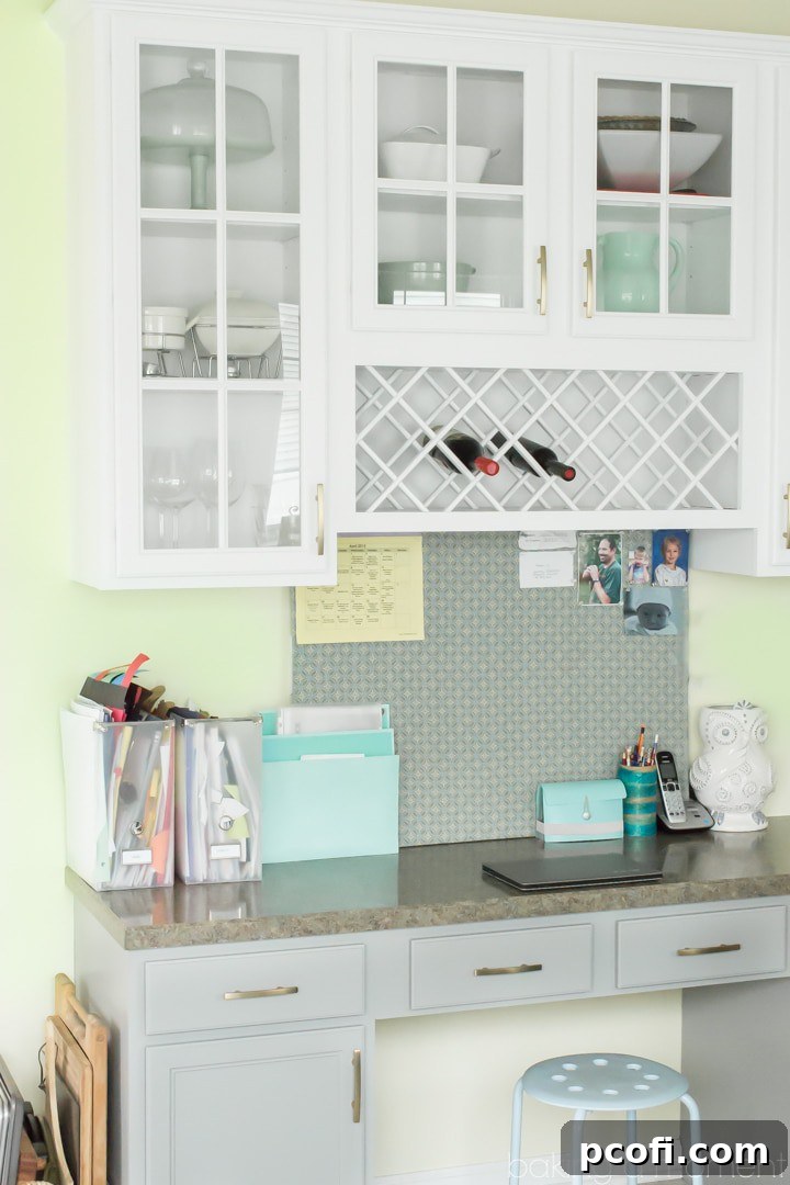 After image of transformed kitchen with white upper and grey lower cabinets