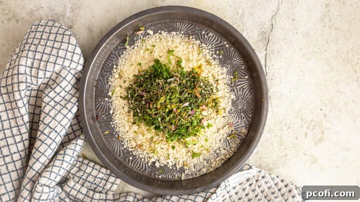 Combining fresh herbs and olive oil with light and crispy panko breadcrumbs in a shallow dish.