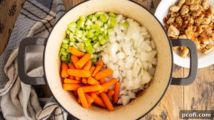 Sauteeing mire poix in a large pot.
