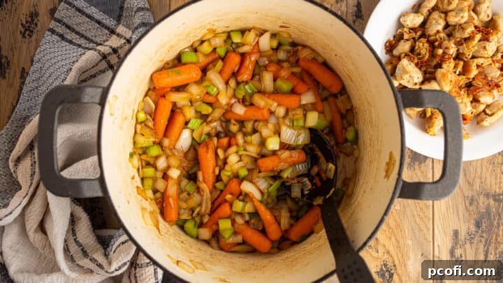 Cooked onions, carrots and celery in a large pot.