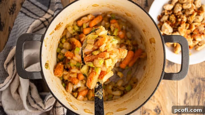 Carrots, onion, and celery coated in roux.