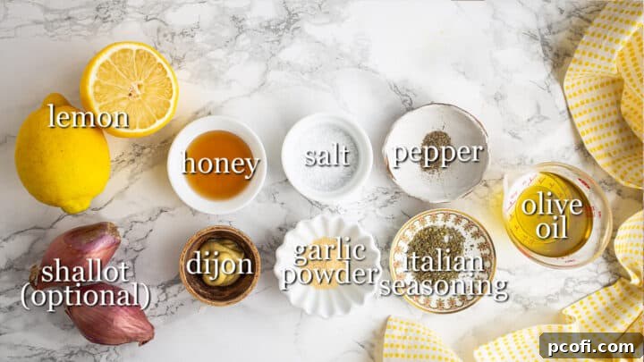Ingredients for making lemon vinaigrette, with text labels indicating lemon, honey, Dijon, oil, shallot, and seasonings.