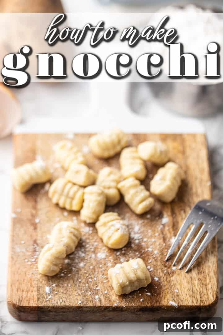Gnocchi dough being shaped on a wooden board with a fork, showcasing the traditional ridges. Learn to make these classic Italian potato dumplings at home.