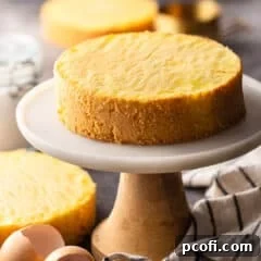 Genoise cake sitting on a marble pedestal.