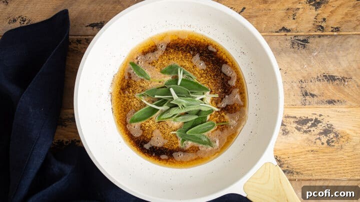 Fresh sage leaves sizzling and browning in rich brown butter, infusing their aromatic essence into the fat.