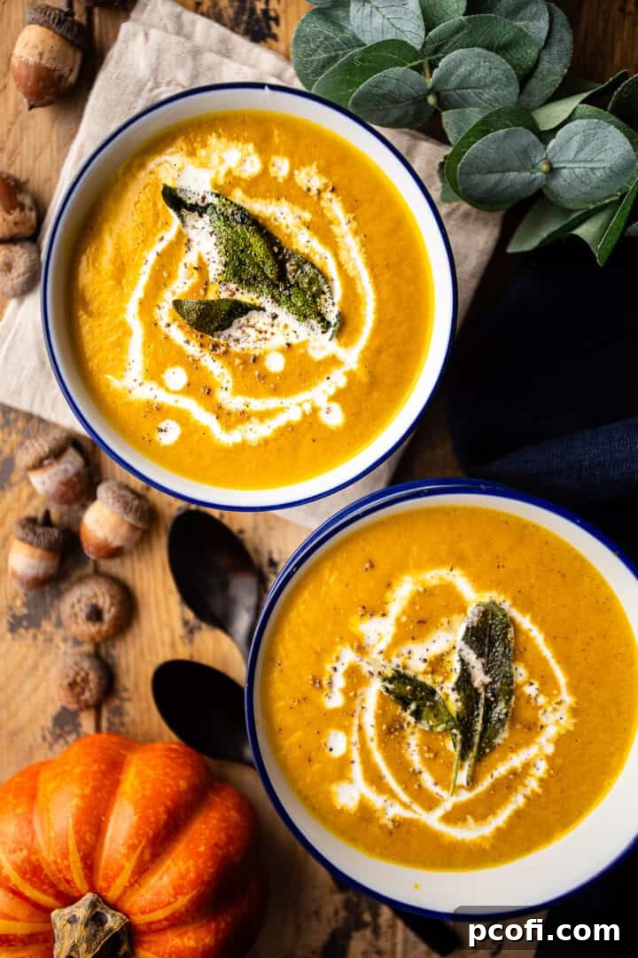 A beautifully prepared pumpkin soup, rich and creamy, presented on a rustic wooden table, ready to be served.