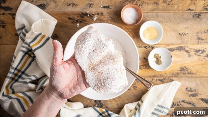 Thin chicken breasts, seasoned and dusted lightly with flour.