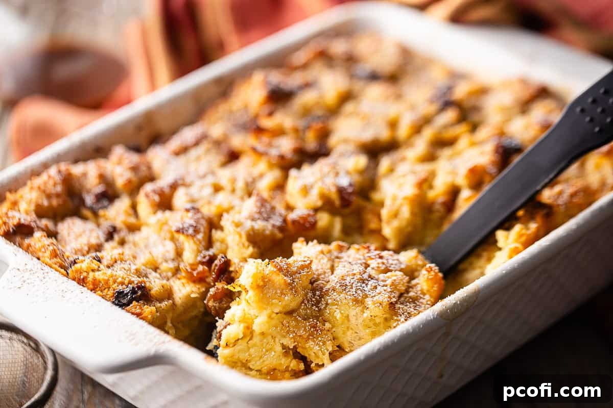 Close-up of bread pudding soaked in custard before baking.