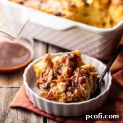 Bread pudding, dusted with powdered sugar and drizzled with salted caramel sauce.