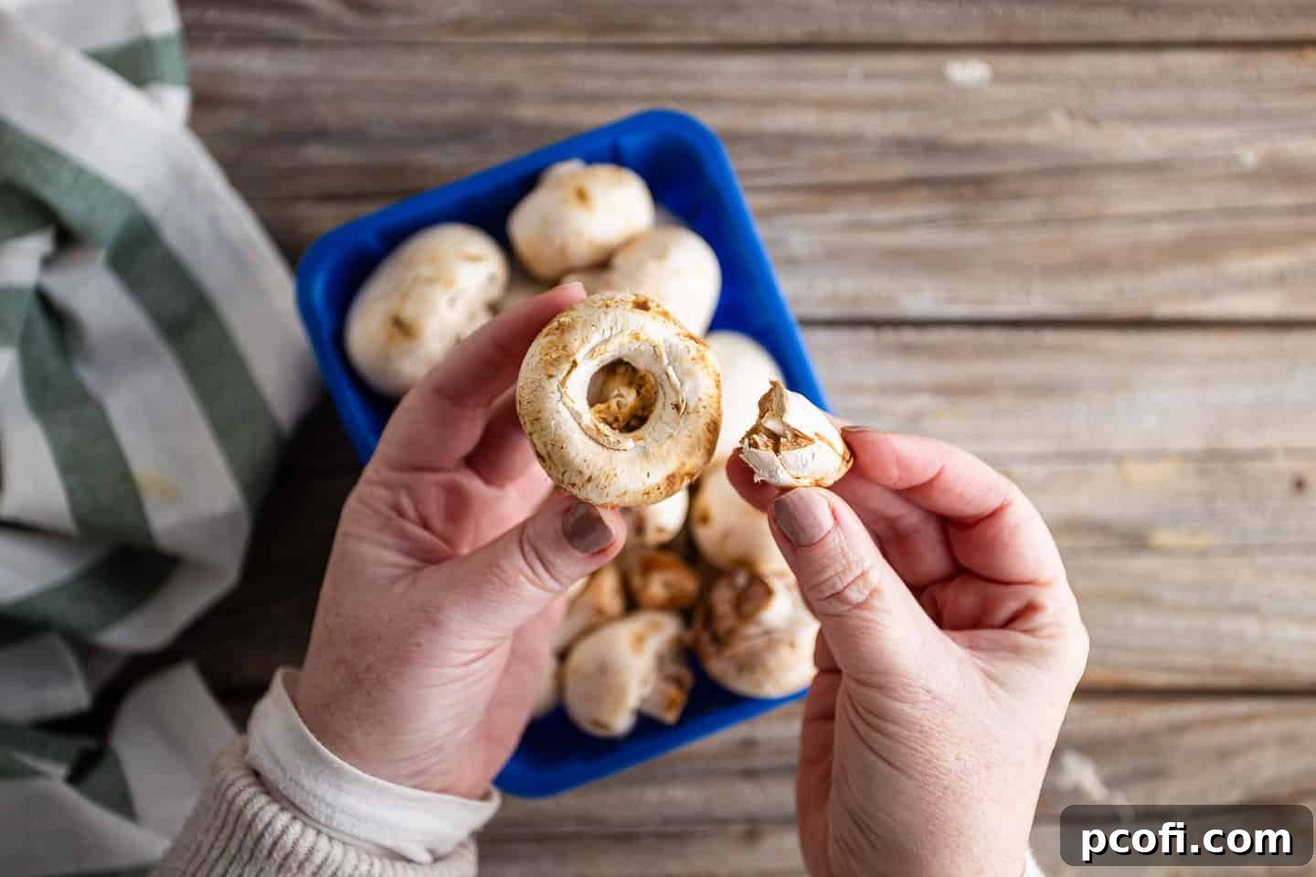 Removing the stems from mushrooms.