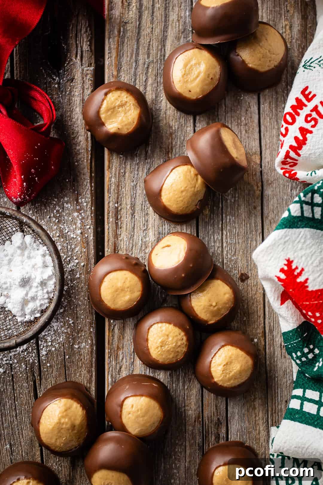 Recipe for buckeyes, made and arranged on a barnwood surface with red and green accents.