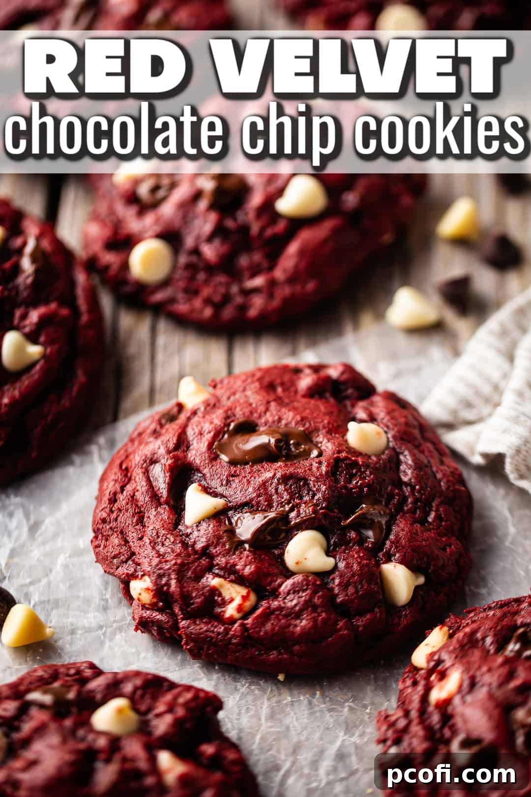 Beautifully arranged red velvet white chocolate chip cookies on a rustic barnwood tabletop, ready to be enjoyed.