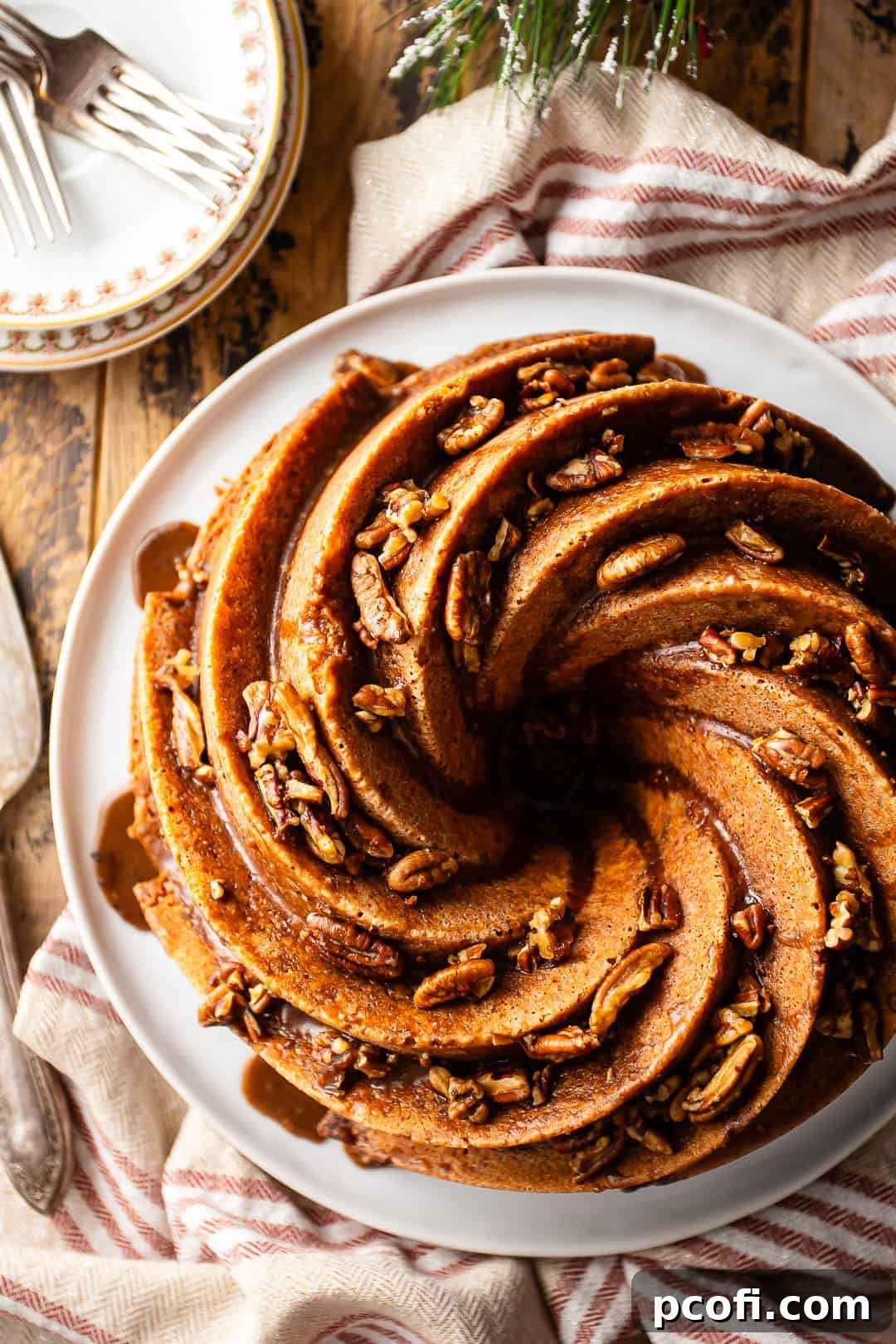 Rum soaked cake, baked in a spiral bundt pan and drenched in a sticky sweet rum glaze, a true delight.