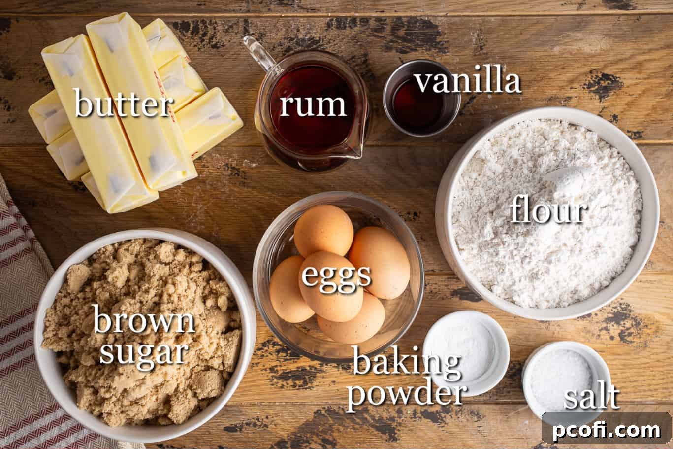 Ingredients for making a delicious rum cake, clearly labeled for easy understanding.