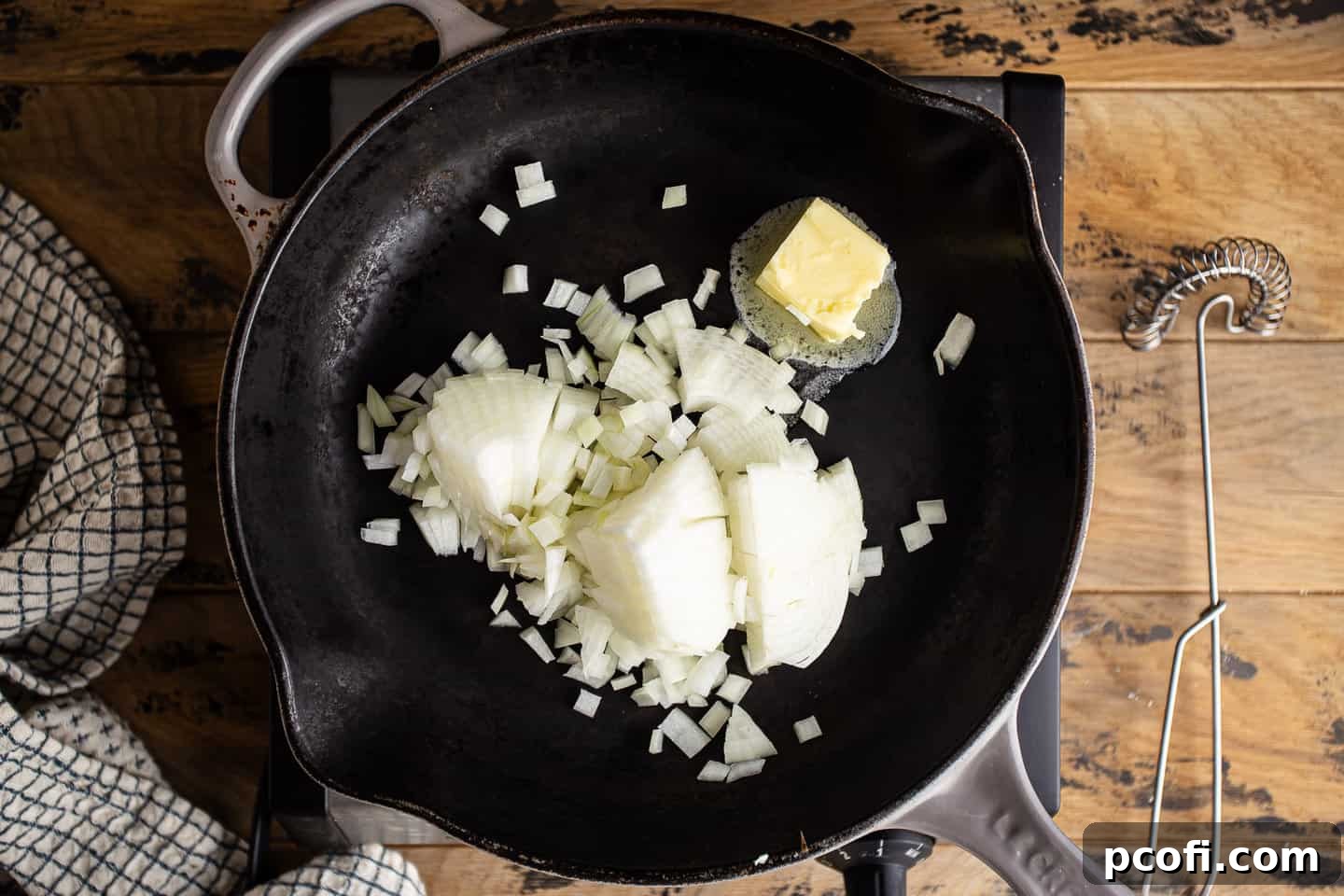 Sauteeing chopped onion in butter.