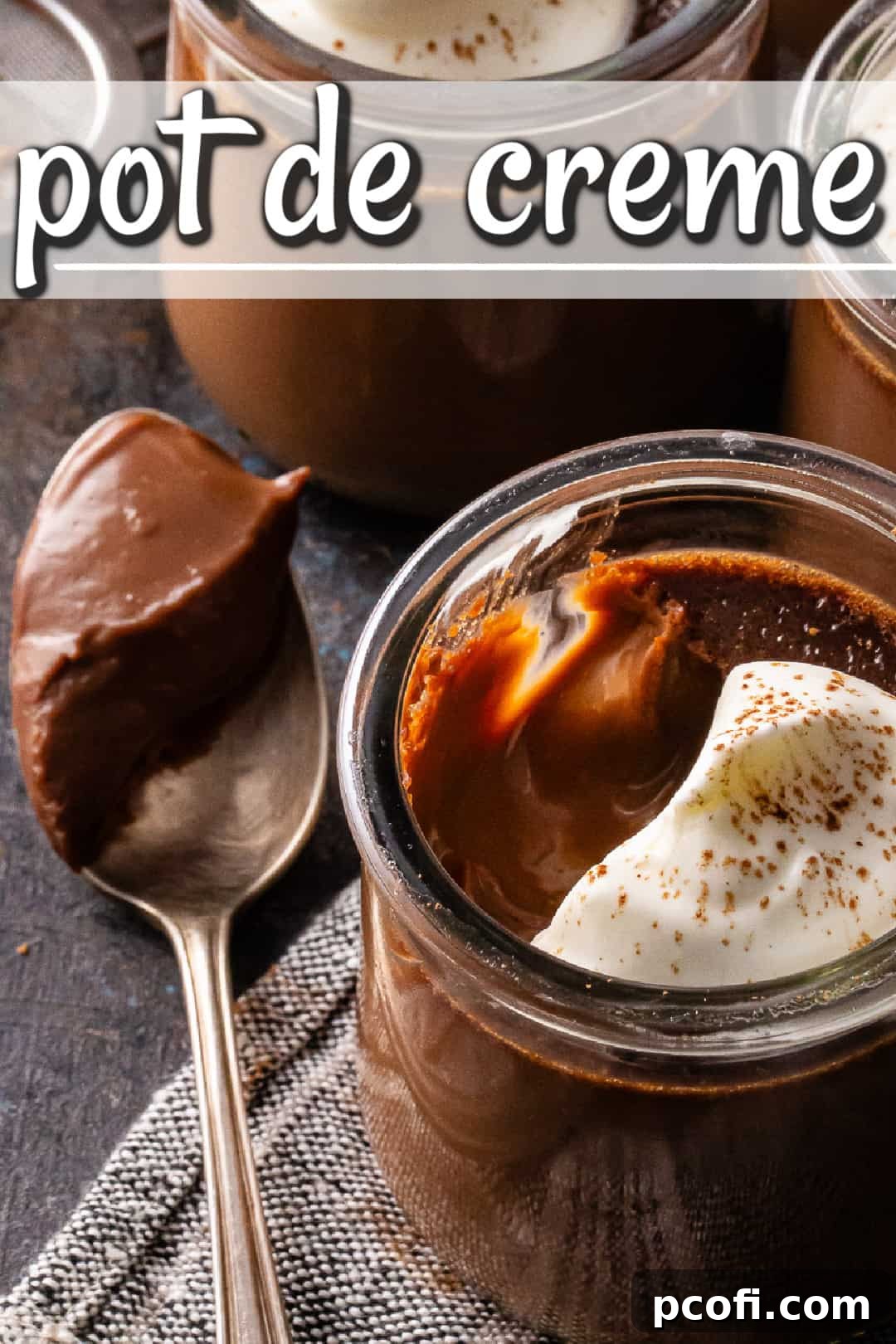 Individual portions of chocolate pots de creme, beautifully presented in small glass jars and garnished with soft peaks of whipped cream, inviting indulgence.