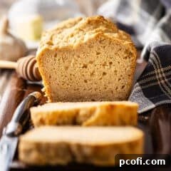 Beer bread recipe, baked and presented on a wooden tray.