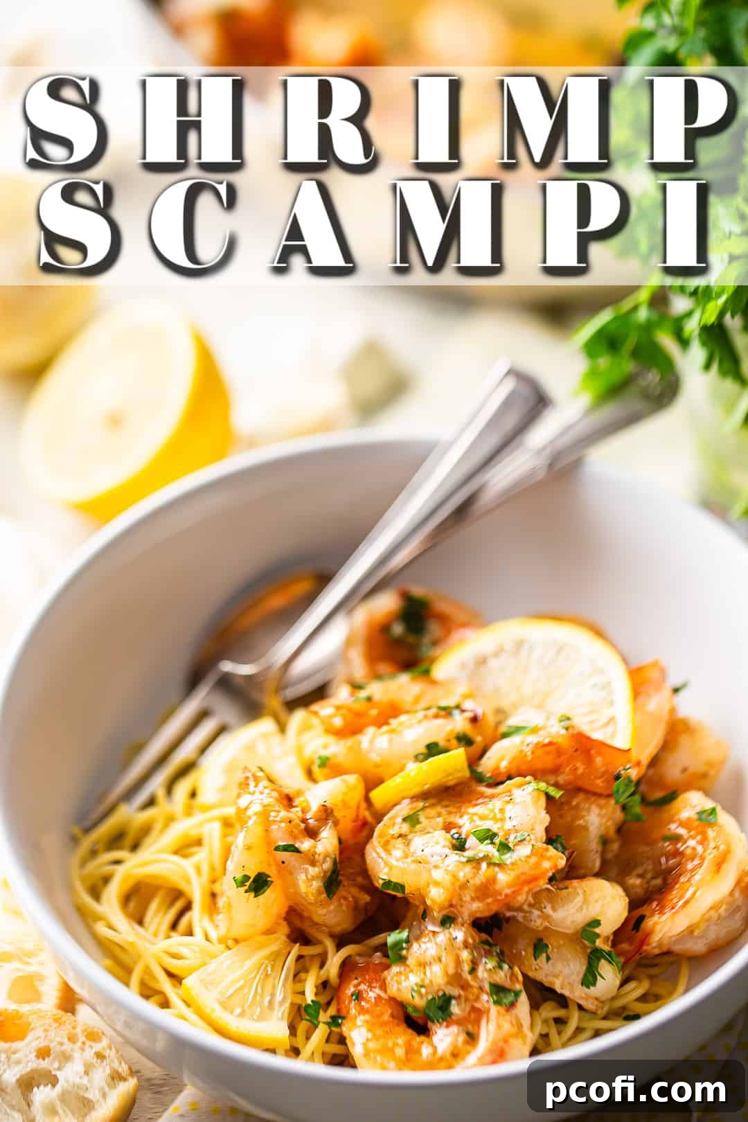 Freshly cooked shrimp scampi garnished with finely chopped parsley and lemon slices, ready to serve.