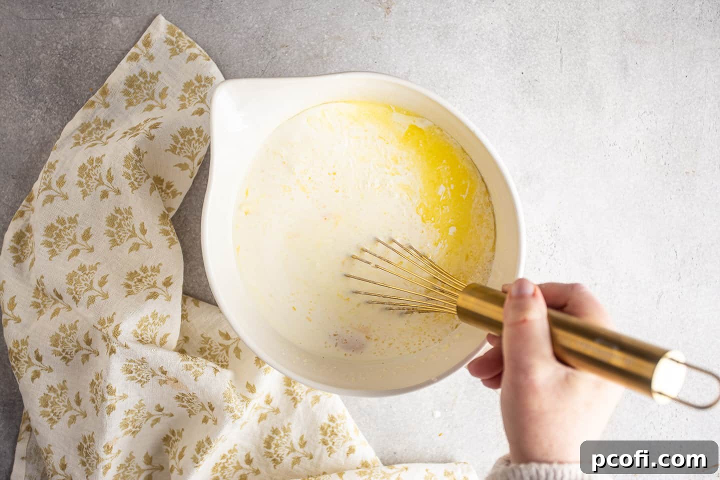 Whisking the custard for bread pudding.