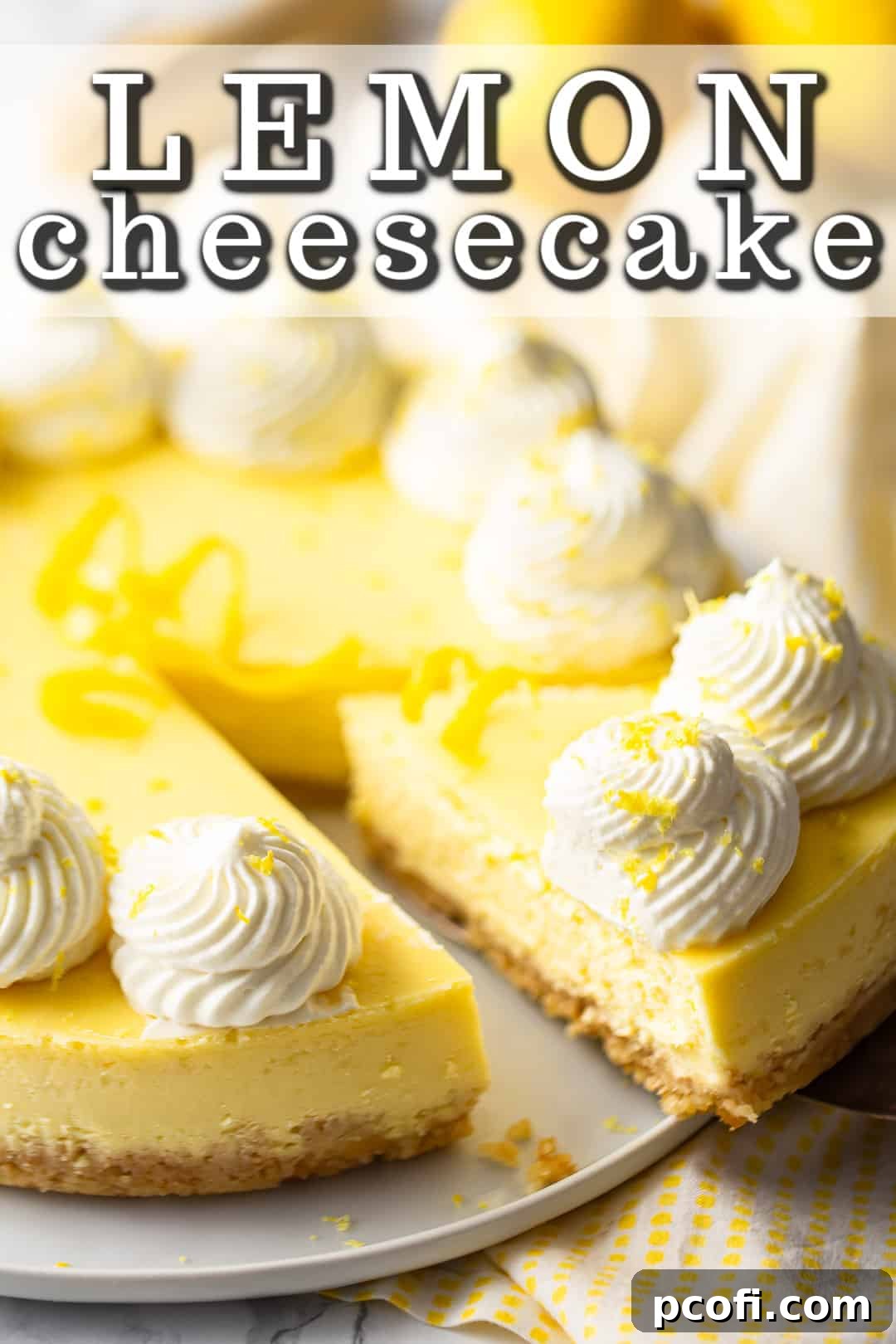 Lemon cheesecake recipe, beautifully baked and garnished with swirls of whipped cream and delicate citrus zest curls on top.