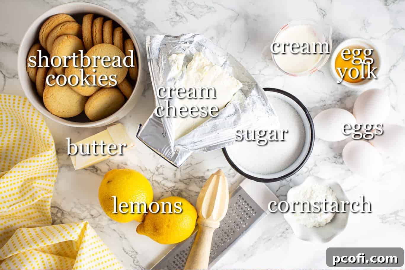 Various ingredients for making lemon cheesecake, neatly arranged with descriptive text labels.