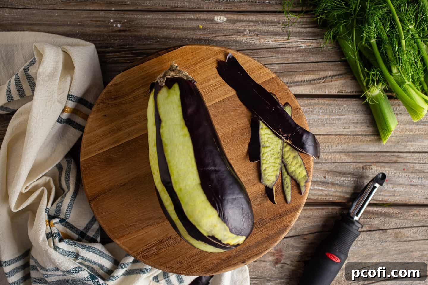 Demonstration of partially peeling an eggplant.