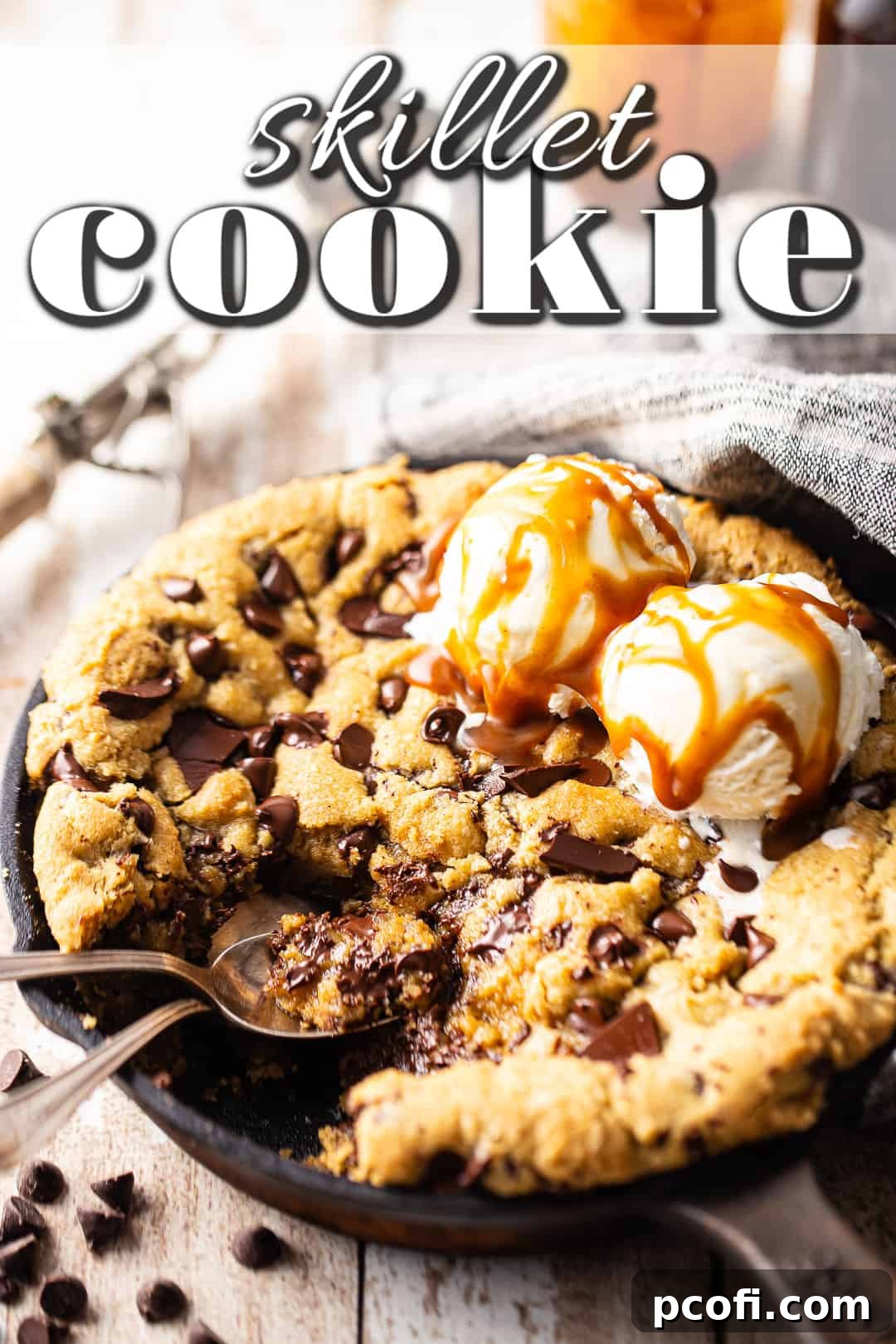 Skillet cookie recipe, baked and topped with luscious ice cream and decadent caramel sauce.
