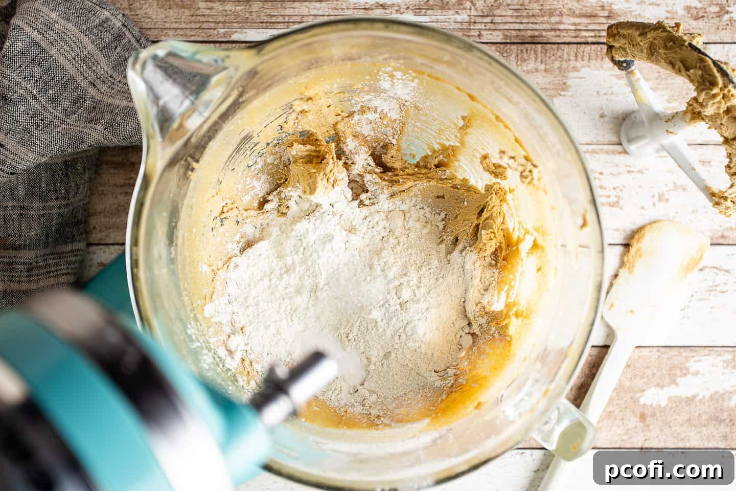 Adding all-purpose flour, cornstarch, baking soda, and salt to the skillet cookie dough.