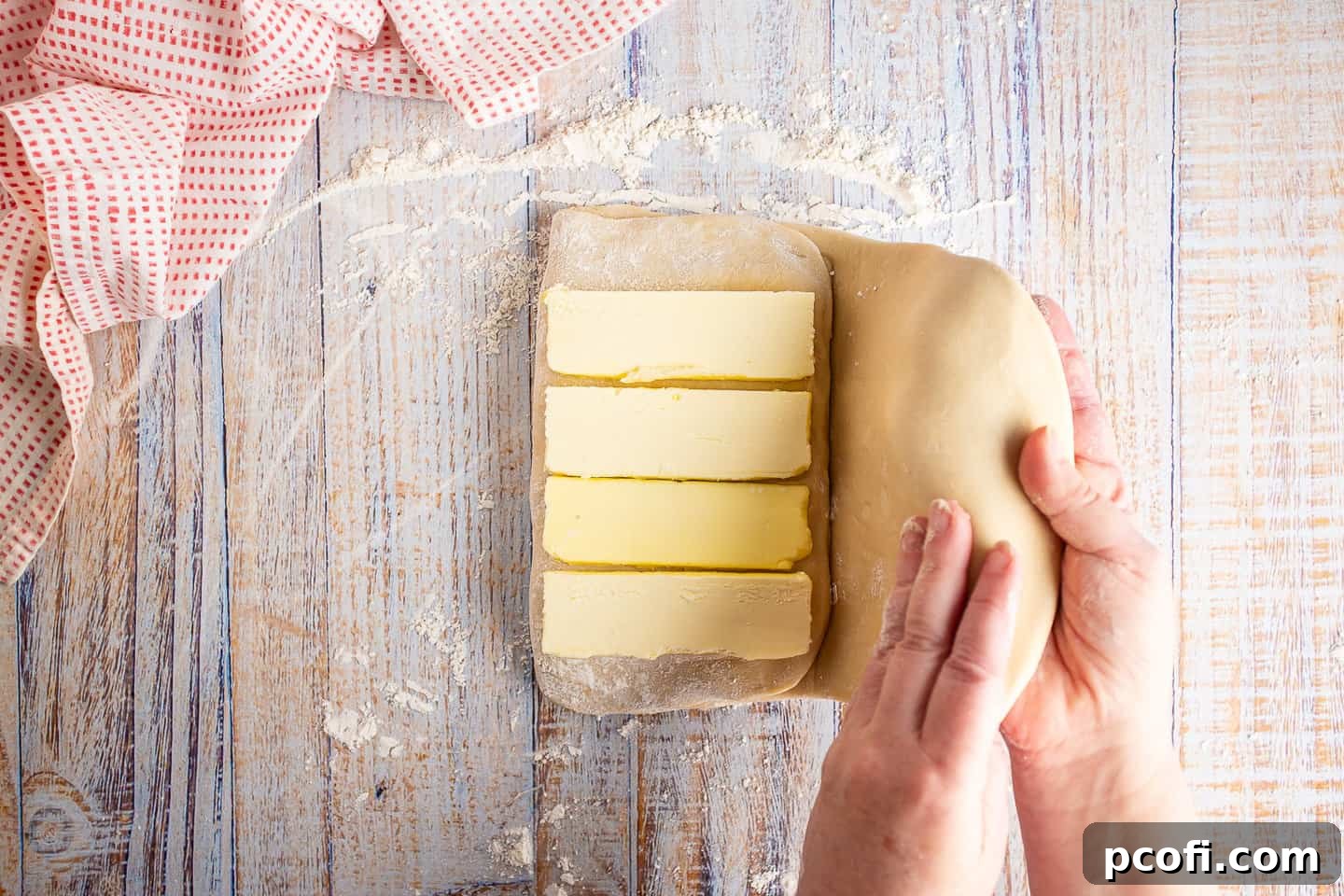 The right side of the Danish dough folded over the second butter layer, sealing the butter inside.
