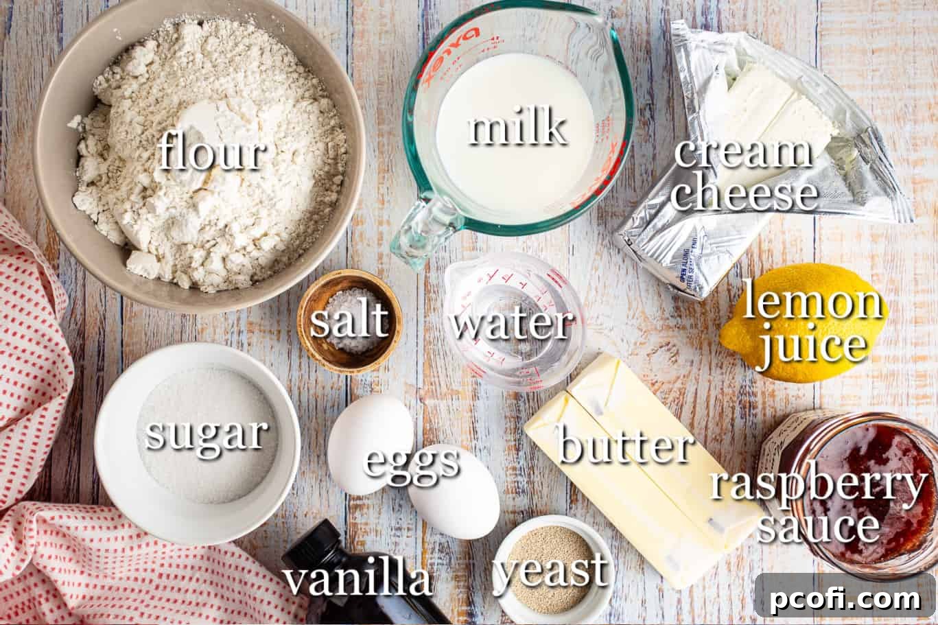 A selection of fresh ingredients laid out for making Cheese Danish, with labels identifying each item.