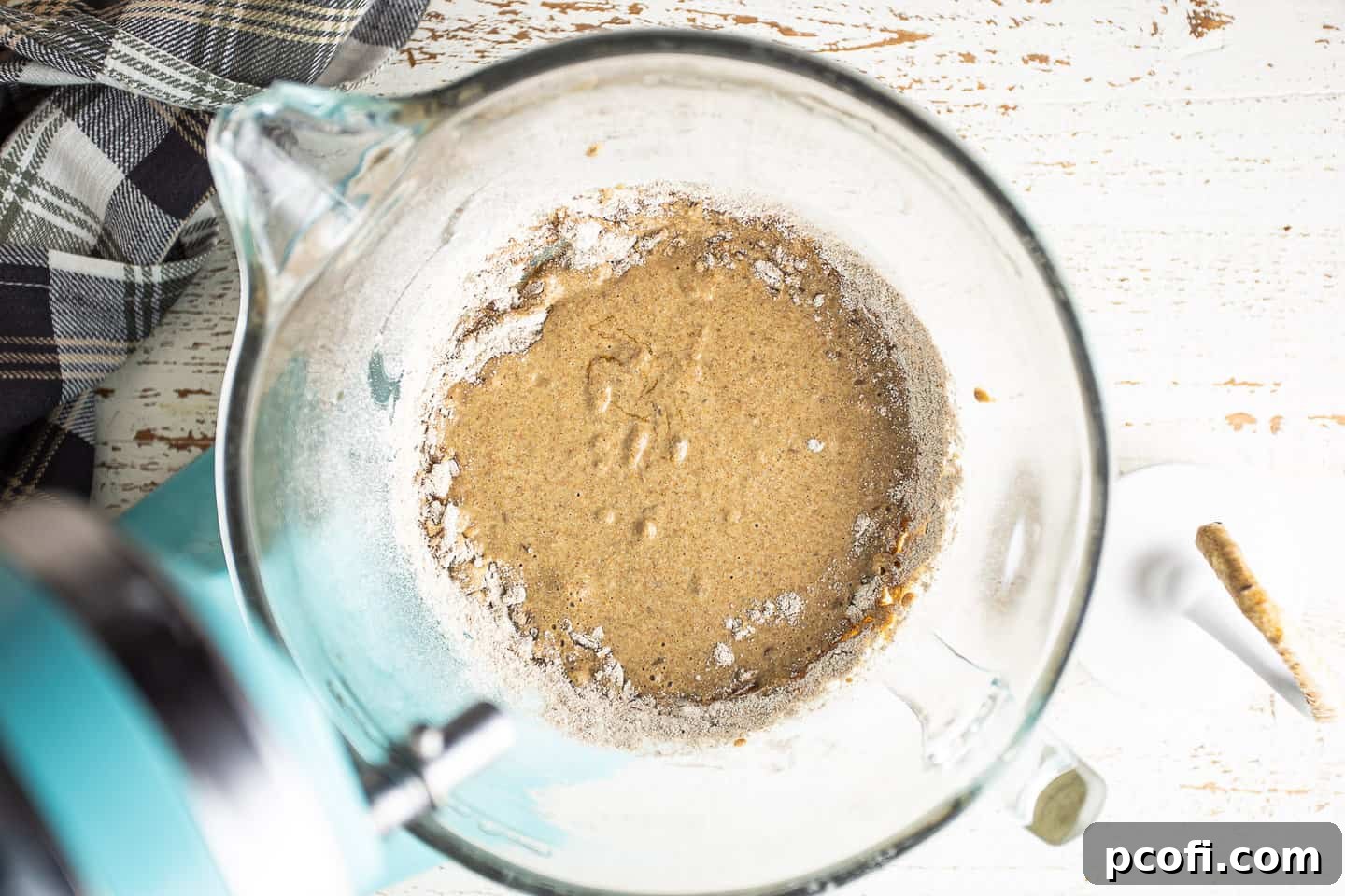Working rye flour into liquid ingredients.