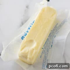 softened butter sitting in butter wrapper, ready for baking.