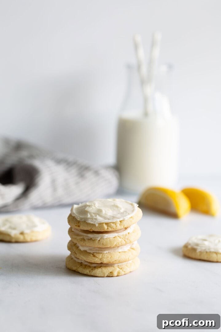 Lemon cookies stacked on top of one another.