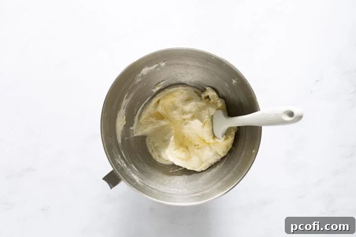 Butter and sugar whipped together in a stand mixer bowl