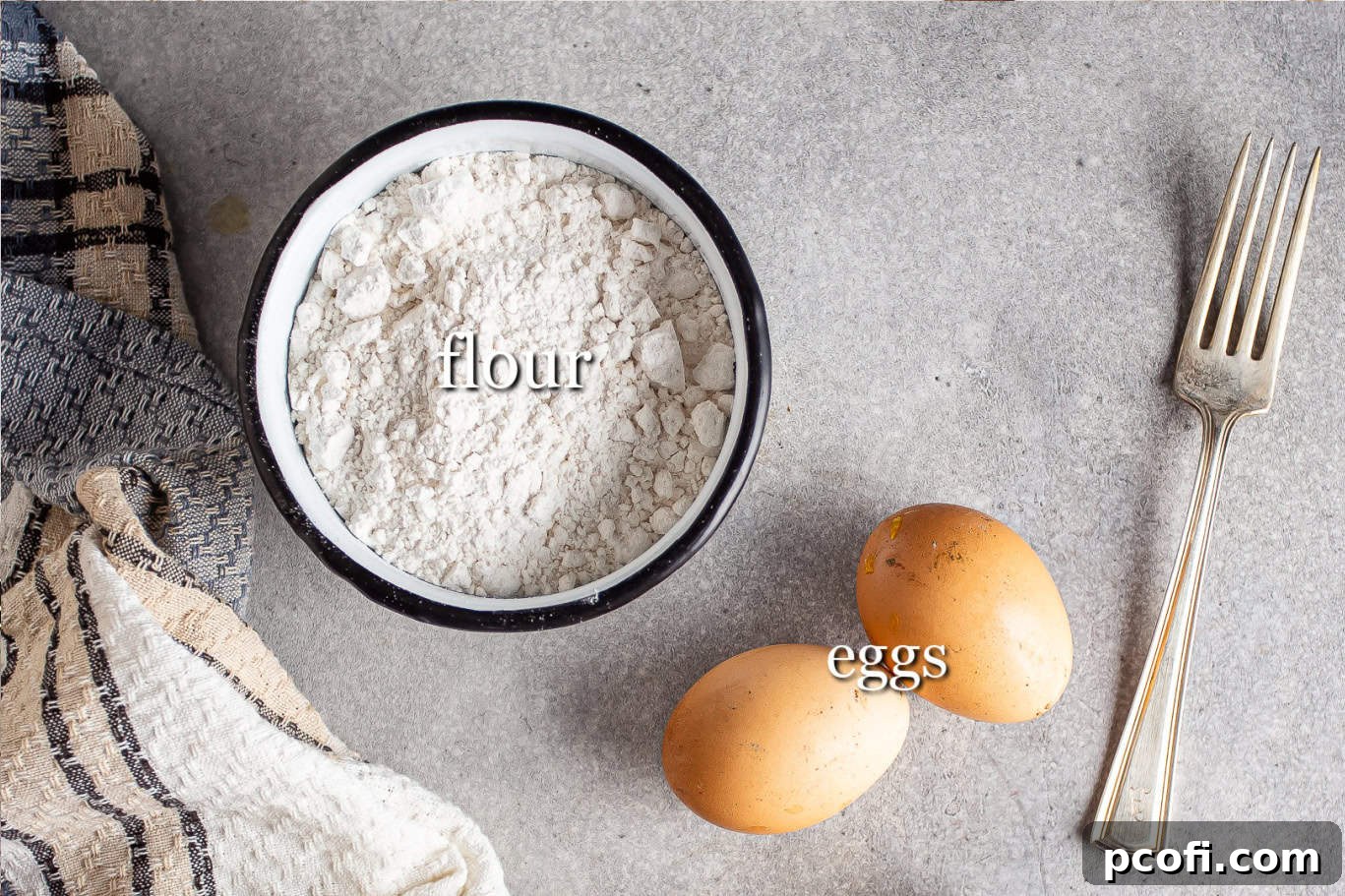 Ingredients for making homemade pasta, with text labels for flour and eggs.