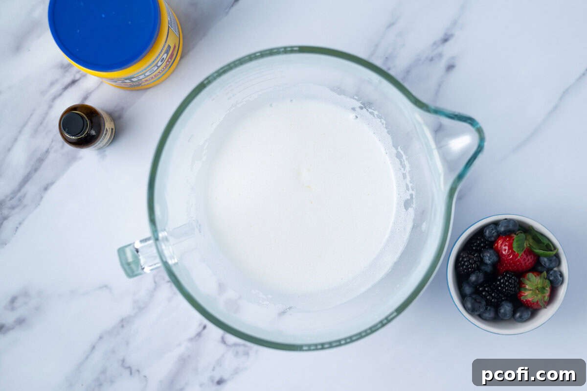 egg whites after all the superfine sugar has been added in a mixing bowl