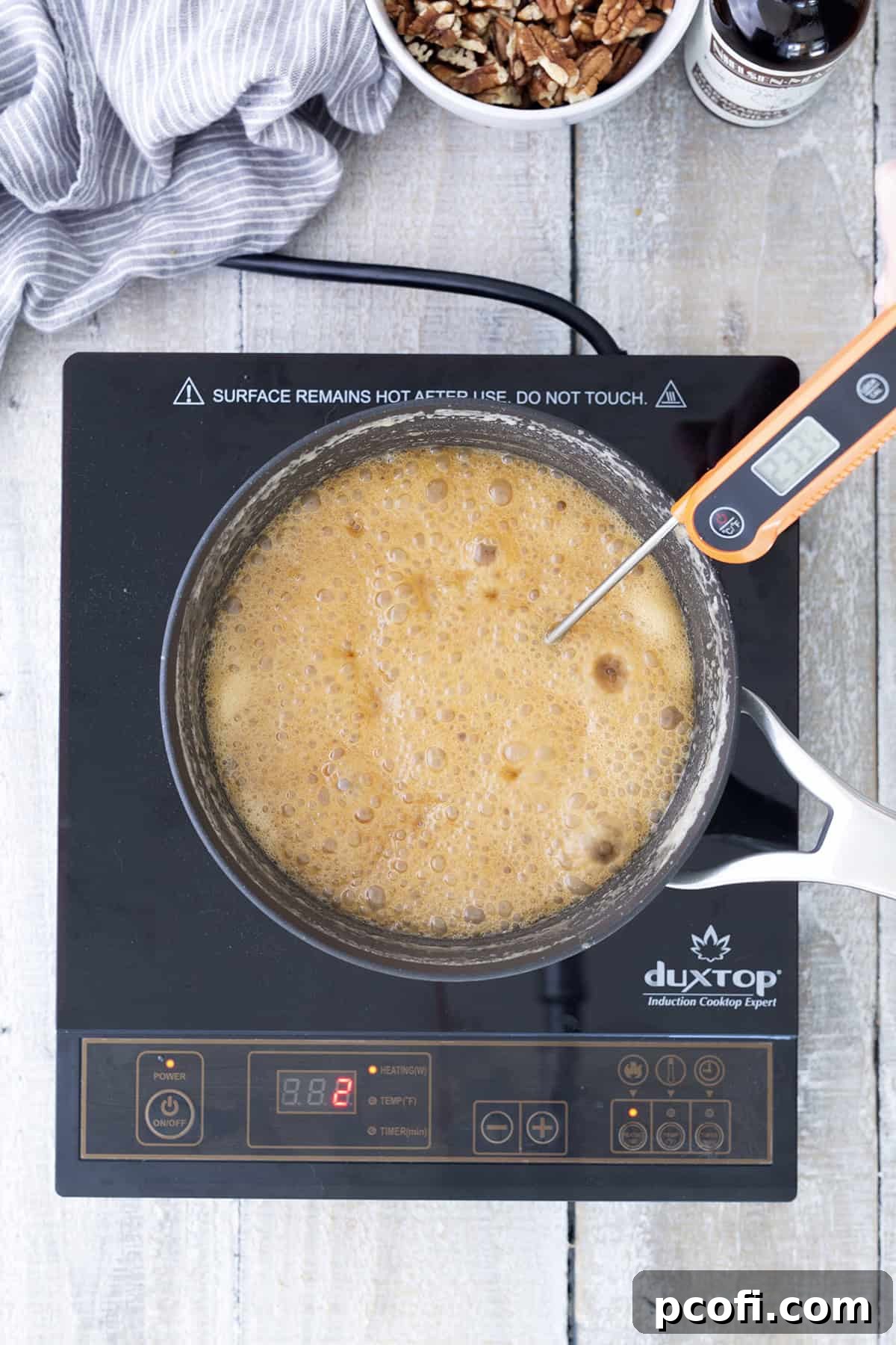 Boiling ingredients in saucepan reaching temperature