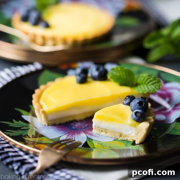 Lemon Cheesecake Tarts: with a buttery shortbread crust, a fluffy no-bake cheesecake base, and tangy lemon curd. One of the best desserts I've ever had! food desserts lemon #ad @mackenziechilds