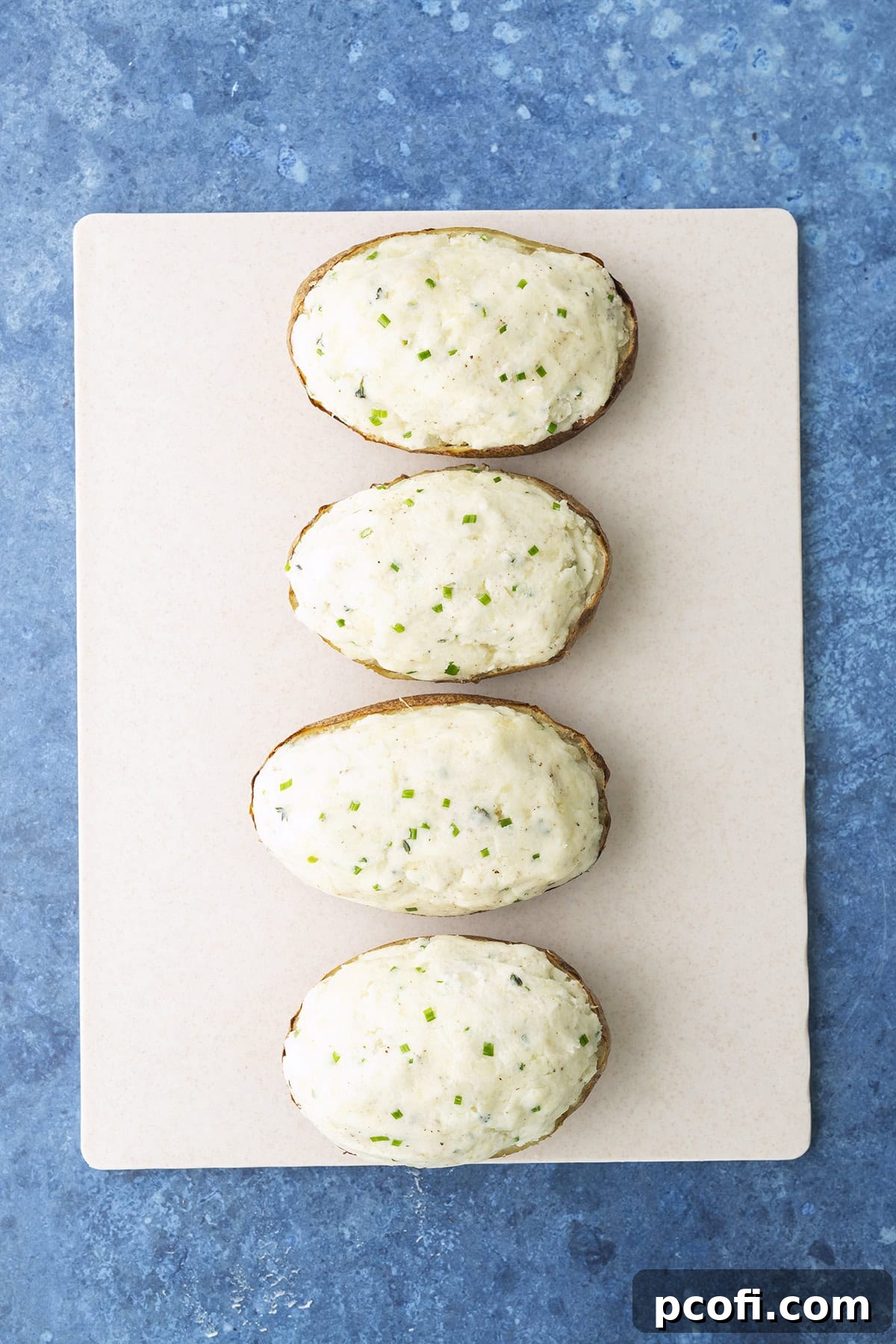 Twice-baked potatoes stuffed with creamy filling, ready for their second bake