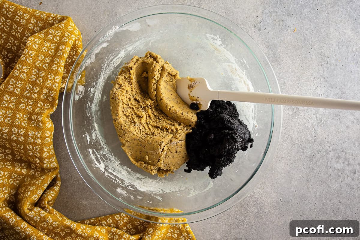 The cookie dough beginning to form as dry ingredients are mixed into the wet ingredients for Earl Grey cookies.
