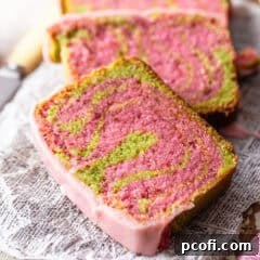 Beautifully sliced Strawberry Matcha Loaf with distinct pink and green swirls.