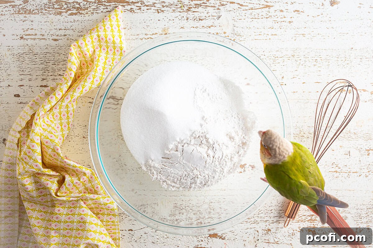 Dry ingredients for the strawberry matcha loaf being whisked together in a glass bowl.
