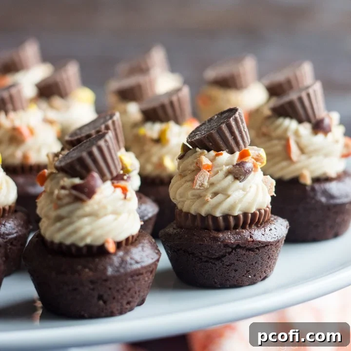 Peanut Butter Cheesecake Brownie Bites: Moist and Fudgy Homemade Brownie Bites, with a REESE’S Peanut Butter Cup tucked inside, topped with Rich Peanut Butter Cheesecake and REESE’S Pieces! Score big with this Chocolate-y treat!