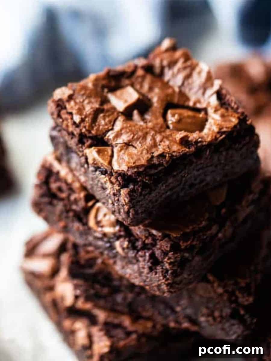A stack of perfectly baked chocolate brownies, showcasing their rich texture.