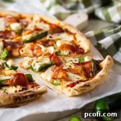 Close-up of a slice of Jalapeño Popper Pizza.
