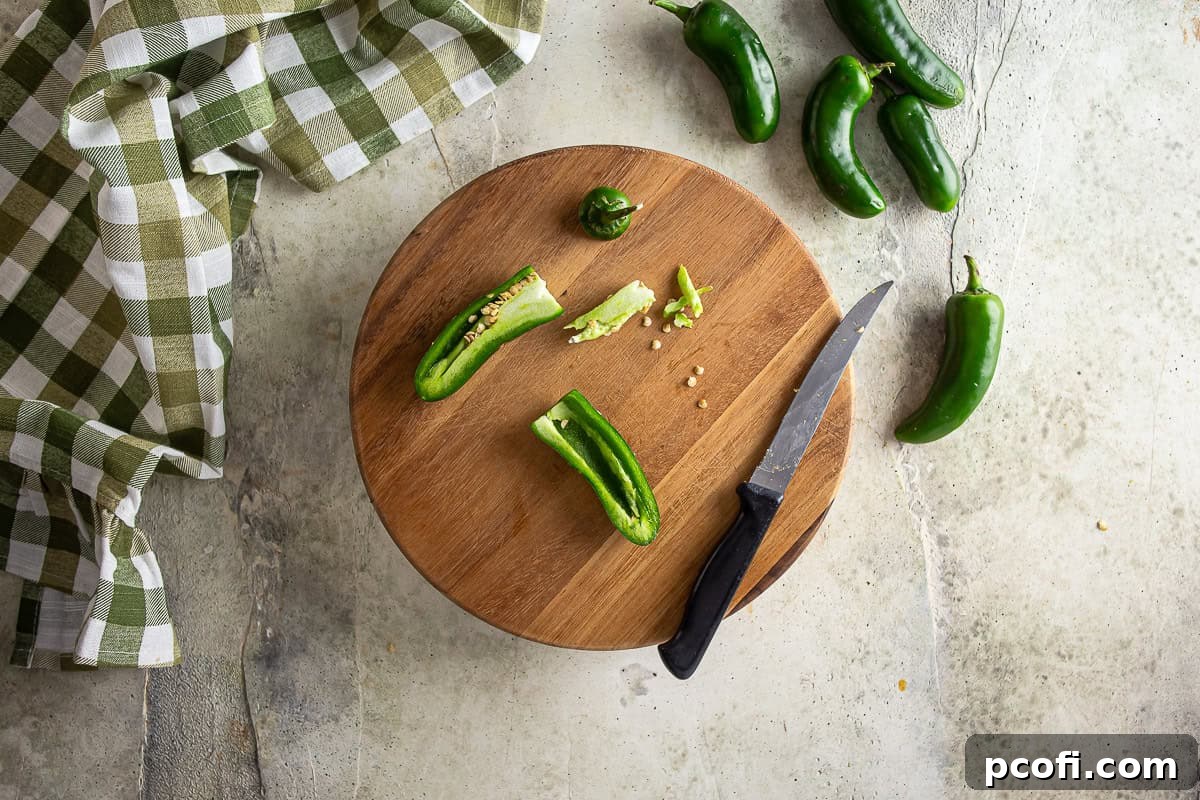Seeding jalapenos for jalapeno popper pizza.