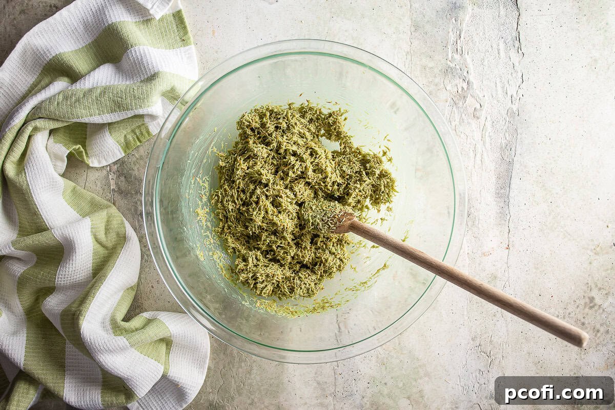 The fully mixed Dubai chocolate filling, a creamy pistachio and crispy kataifi blend, ready to be layered into chocolate cups.